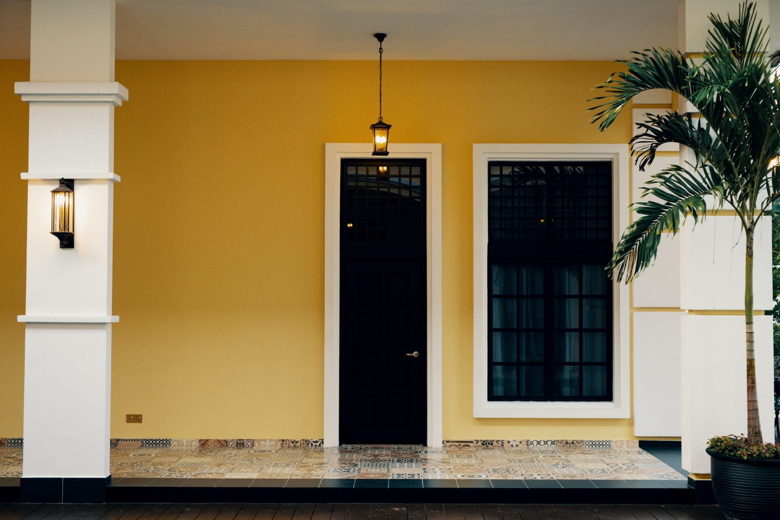 Colonial-inspired entrance of The Agam, blending Malaysian heritage with modern architectural elements.